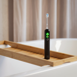 Sonic-oscillating toothbrush with active gum protection